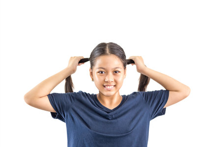 Little preschool girl with smile hand holding her hands isolated in clipping path.の写真素材