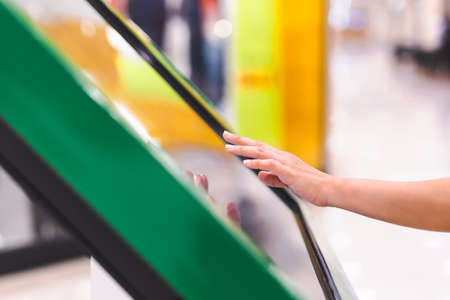 woman hand uses digital touch screen to get information.の写真素材
