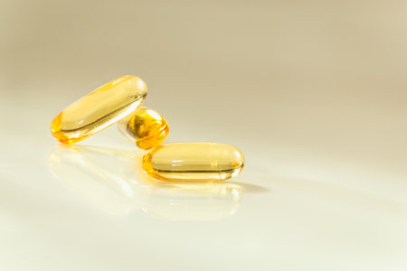 Health care concept close up capsules Omega 3 on blurred background.の写真素材