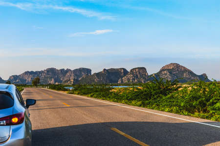 Car moves on mountain road on summer sunny day, Vacation conceptaul.の写真素材