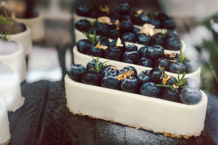 Closed up blue berry cheese cake sale in the refrigerators in cafe.の写真素材