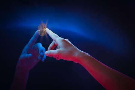 Hand touch virtual globe and bitcoin crypto currency investmentの写真素材