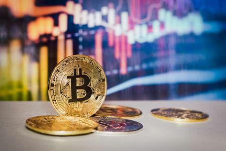 Gold bitcoin with trading graph chart in background Virtual cryptocurrency conceptの写真素材