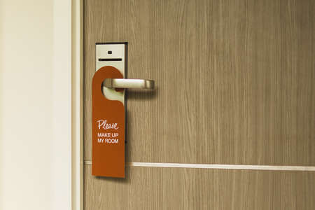 Close up of the sign on door handle with wording PLEASE MAKE UP MY ROOMの写真素材