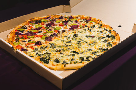 New York style pizzas takeout isolated in black background.の写真素材