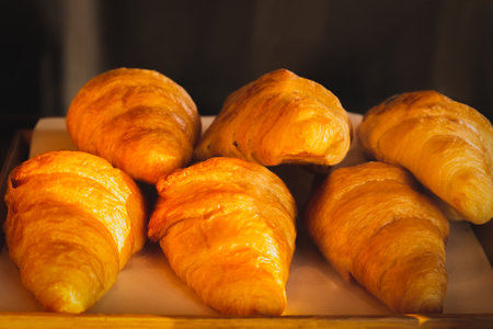 Golden Delight a flaky freshly baked croissanの写真素材