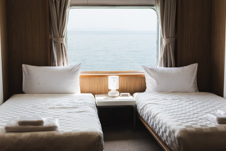 Bedroom with interior of double passenger cabin ferry ship with ocean view.の写真素材