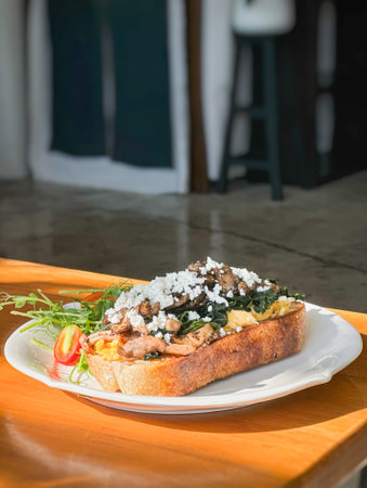 Healthy breakfast with srambled eggs, spinach and on toasted sourdough breaの写真素材
