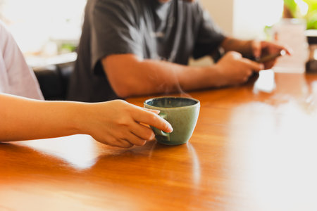 Woman and man relaxing in morning drink coffee in cafe