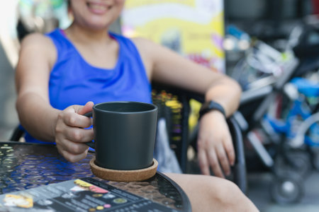 Happy woman drinking coffee in the morningの写真素材