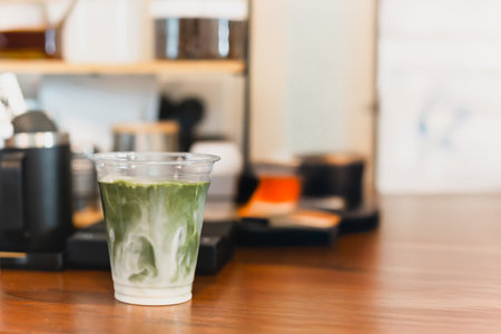 Iced matcha green tea latte in take out glassの写真素材