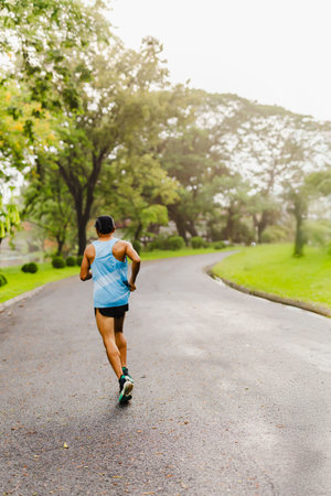 Runner man athlete jogging in the parkの写真素材