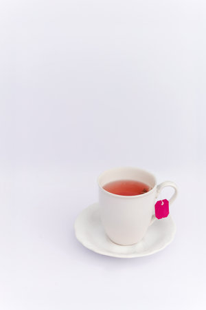 Relaxing concept hot herbal tea in white mug on white background.の写真素材