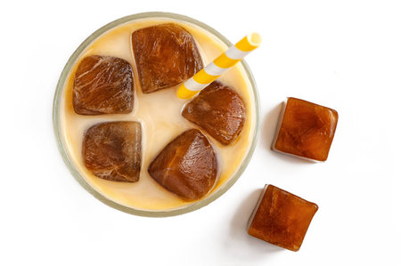 Milk coffee cocktail from frozen coffee cubes isolated on white background. top view.の写真素材