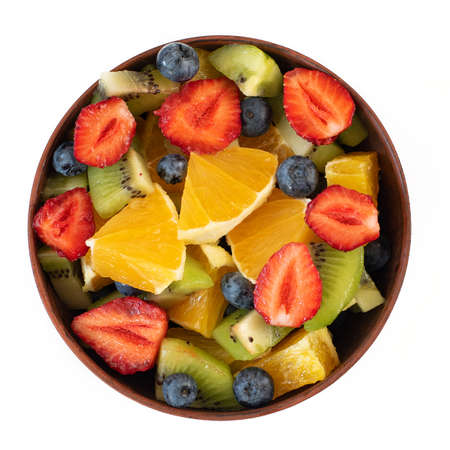 Bowl of healthy fresh fruit salad isolated on white background. Top view.の写真素材