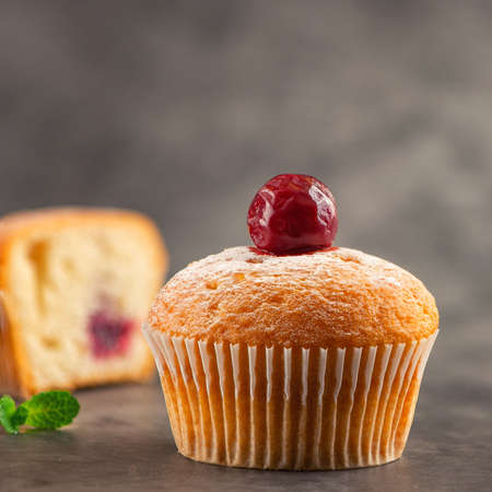 Cherry muffin on dark background. Side view.の写真素材