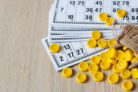 Tabletop old lotto game. Cards bingo on light background.