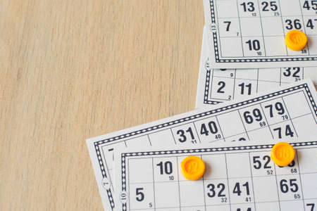 Tabletop old lotto game. Cards bingo on light background.の写真素材