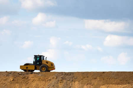 Building a road with varied machinery against the sky. Copy Space.の写真素材