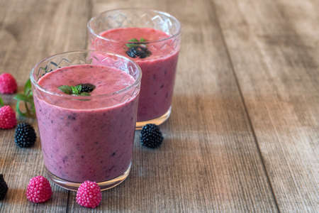 Strawberry milkshake with berries in the glass jar.の写真素材