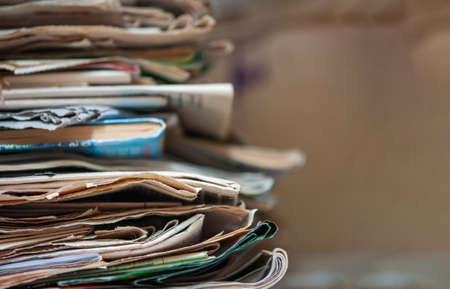 Pile of old newspapers and magazines. With copy space.の写真素材