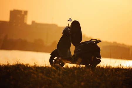 motorcycle at sunset on the background of building.の写真素材