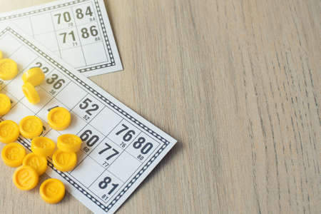 Tabletop old lotto game. Cards bingo on light background.の写真素材