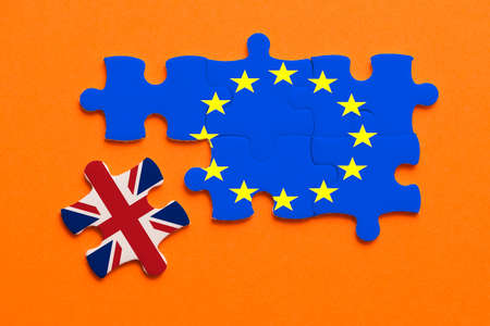 Brexit jigsaw puzzle concept on orange background.の写真素材