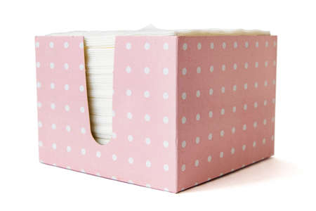 paper napkins in box isolated on white background.の写真素材