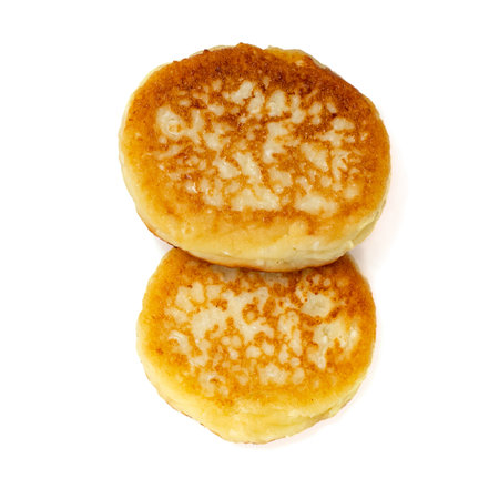 Freshly baked cheese pancakes isolated on white background. Top view.の写真素材