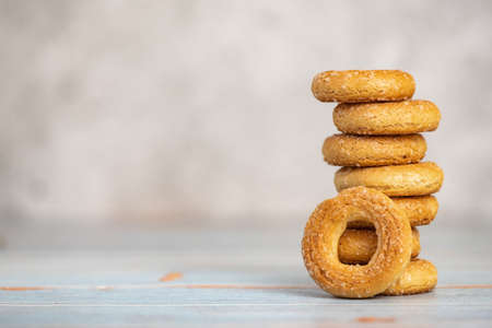 Stack of small sweet bagels on light background. With copy space.の写真素材