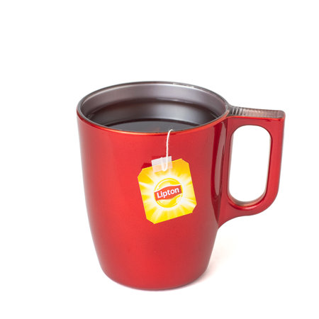 KROPIVNICKY, UKRAINE - JANUARY 11, 2019: Lipton tea in red cup isolated on white background.のeditorial素材