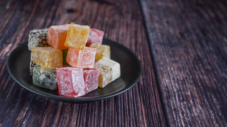 Turkish delight on a dark wood background. selective focus. Front view.の写真素材