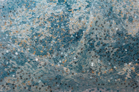 Pale blue Sequins Background. Blue background.
