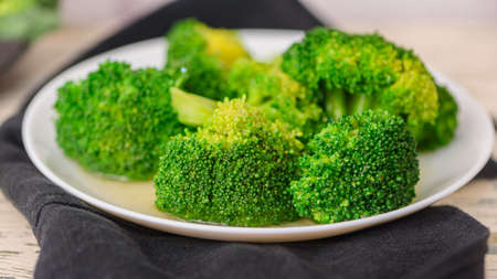 Fresh green broccoli on a light background. Macro photo green fresh vegetable broccoli. Green Vegetables for diet and healthy eating. Organic food. green vegetables.の写真素材