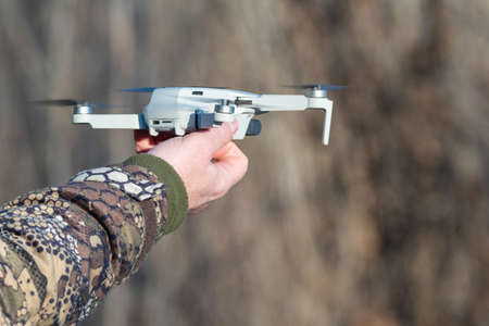 Male hands close-up drone. The concept of leisure, hobby, entertainment.の写真素材