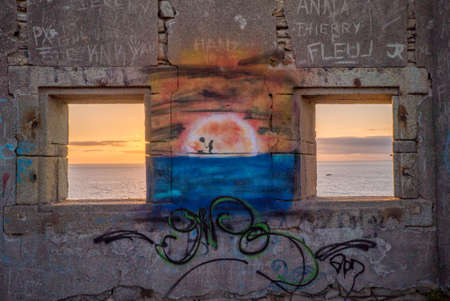 Windows open on a sunset on the seaの写真素材