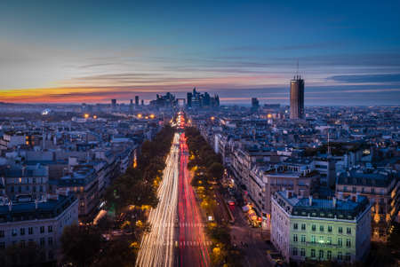 La defense Arch and business district in Paris seen from the Arc de triomphe at sunset