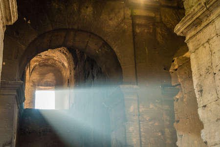 Sunlight coming from a window of the Colosseum in Romeの写真素材