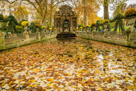 Medici fountain in Jardin du Luxembourg in France, in autumn covered with leavesのeditorial素材