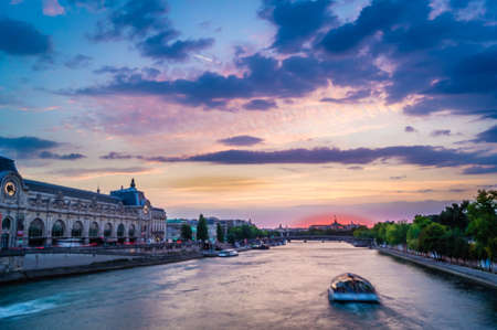 Blue sunset over Orsay Museum and Seine river in Parisの写真素材