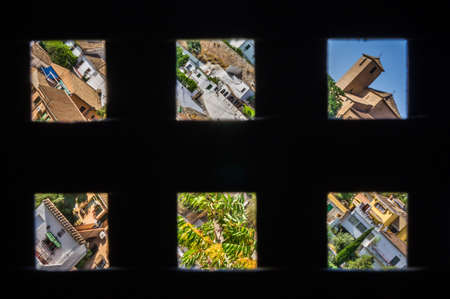 Old Granada seen by a window of the Alhambraの写真素材