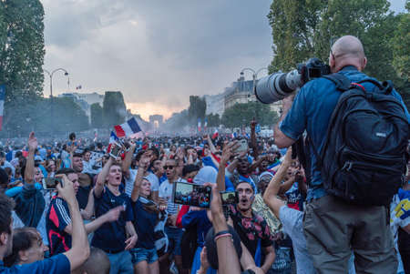 Photographer photographing crow in Paris on the Champs Elysees Avenue after the 2018 World Cupのeditorial素材