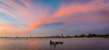 Melbourne skyline and skyscrapers with a pink and purple sunset in the skyのeditorial素材