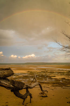 Rainbow over the sea in Fraser Island in Australiaの写真素材
