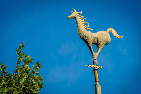 Horse Weathervane and blue sky in Melbourne, Victoria, Australiaの写真素材