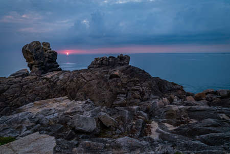 La Torche in Finistere, sunset at the horizonの写真素材