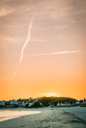 Sun disappearing over Audiernes beach in Franceの写真素材