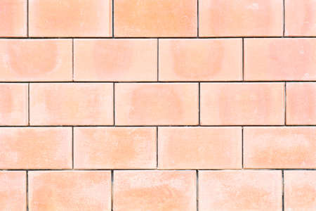 Square orange brick wall background 