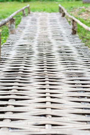 Old wooden bridge over the riverの写真素材